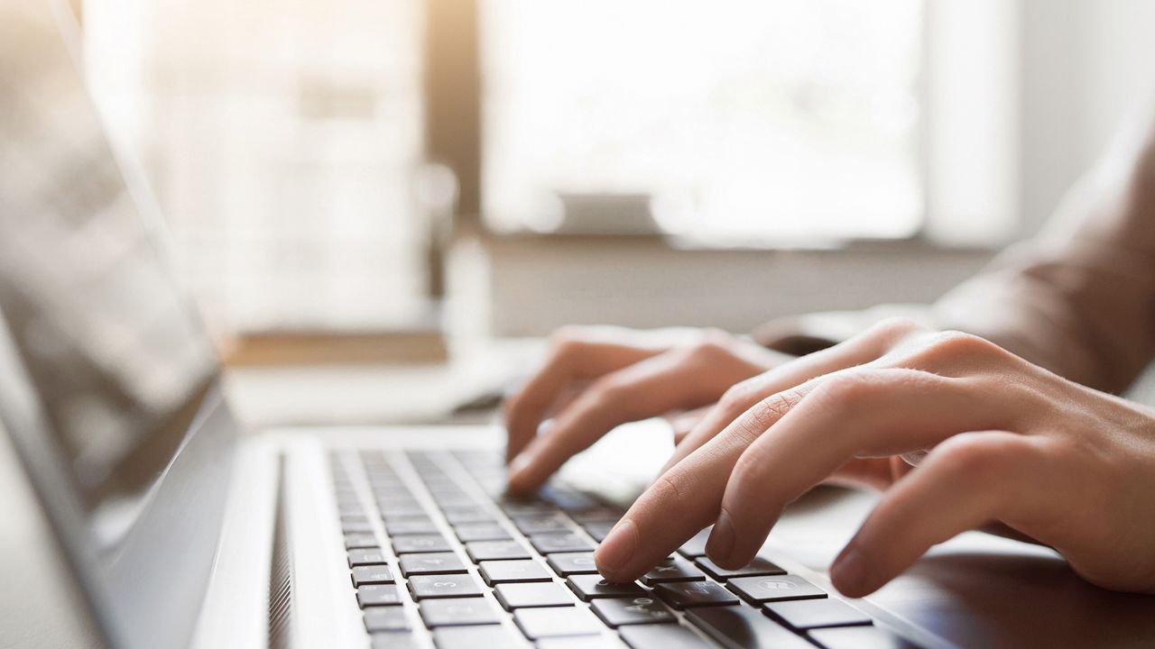 File image of a person typing on a laptop. (iStock)