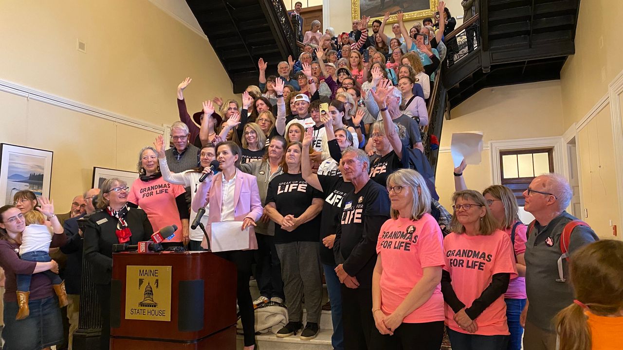 Rep. Laurel Libby (R-Auburn) addresses a large crowd of abortion opponents Monday at the State House. (Susan Cover/Spectrum News)