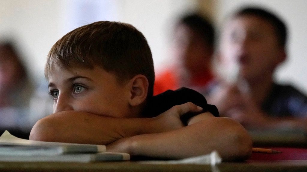 third graders pay attention during a lesson in reading class