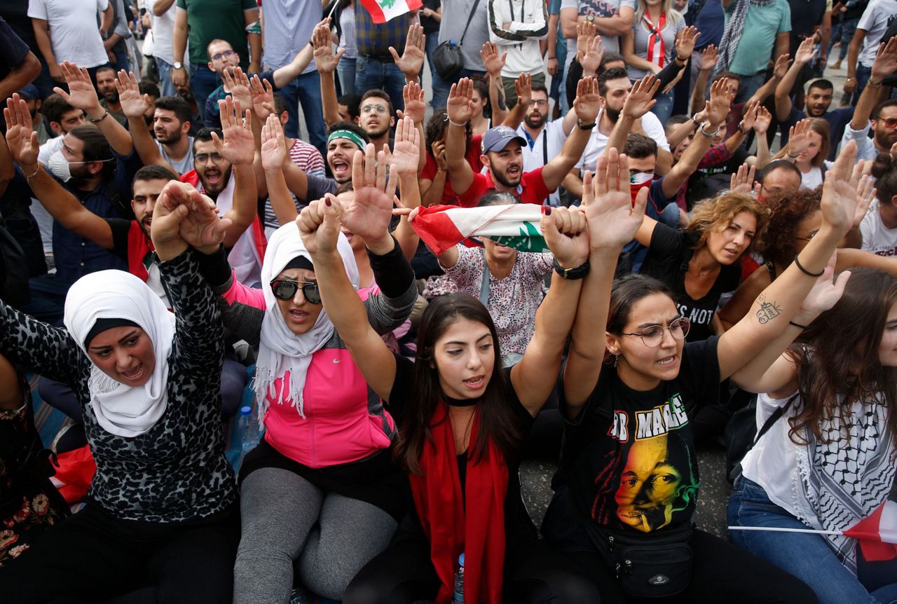 Lebanese block roads as mass demonstrations enter 10th day