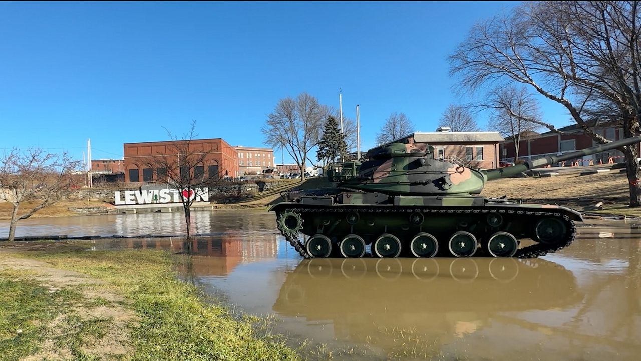 The Androscoggin River, still above flood stage Wednesday morning, partially submerged parts of Veterans Memorial Park in Lewiston. The river has officially crested, and is expected to continue dropping. (Spectrum News/Sean Murphy)