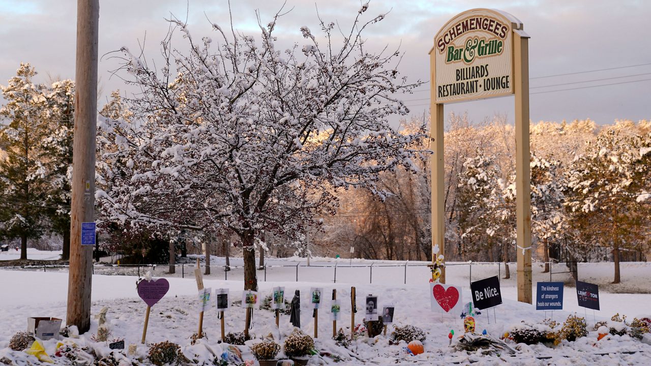 Snow accumulates outside a restaurant at a makeshift memorial for the victims of last month's mass shooting in Lewiston, Maine, Tuesday, Dec. 5, 2023. The four members of Maine's congressional delegation are calling for an Army investigation into the events leading up to a mass shooting in the state in the wake of meeting with families affected by the killings. (AP Photo/Robert F. Bukaty, File)