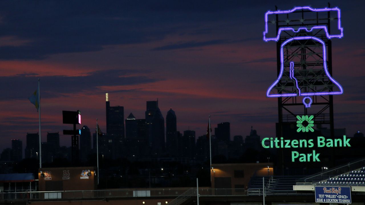 The Philadelphia skyline is dark during sunset at Citizens Bank Park in Philadelphia on Aug. 6, 2020. Philadelphia is part of the Lights Out initiative. (AP Photo/Matt Slocum)