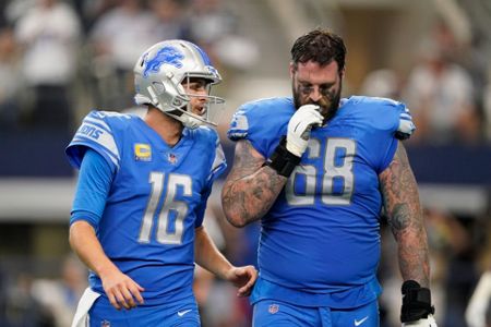 ARLINGTON, TX - OCTOBER 23: The Dallas Cowboys huddle up during