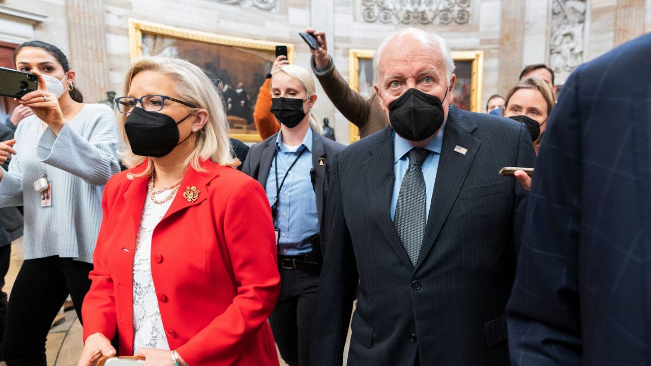 Former Vice President Dick Cheney walks with his daughter Rep. Liz Cheney, R-Wyo., vice chair of the House panel investigating the Jan. 6 U.S. Capitol insurrection, in the Capitol Rotunda at the Capitol in Washington, Jan. 6, 2022. (AP Photo/Manuel Balce Ceneta, File)