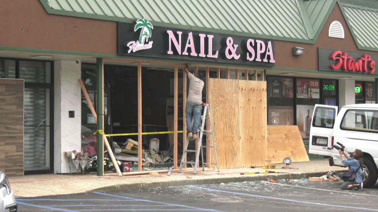 Police said Steven Schwally, 64, had been speeding through the parking lot when he drove his SUV through the front of the salon. (Spectrum News NY1)