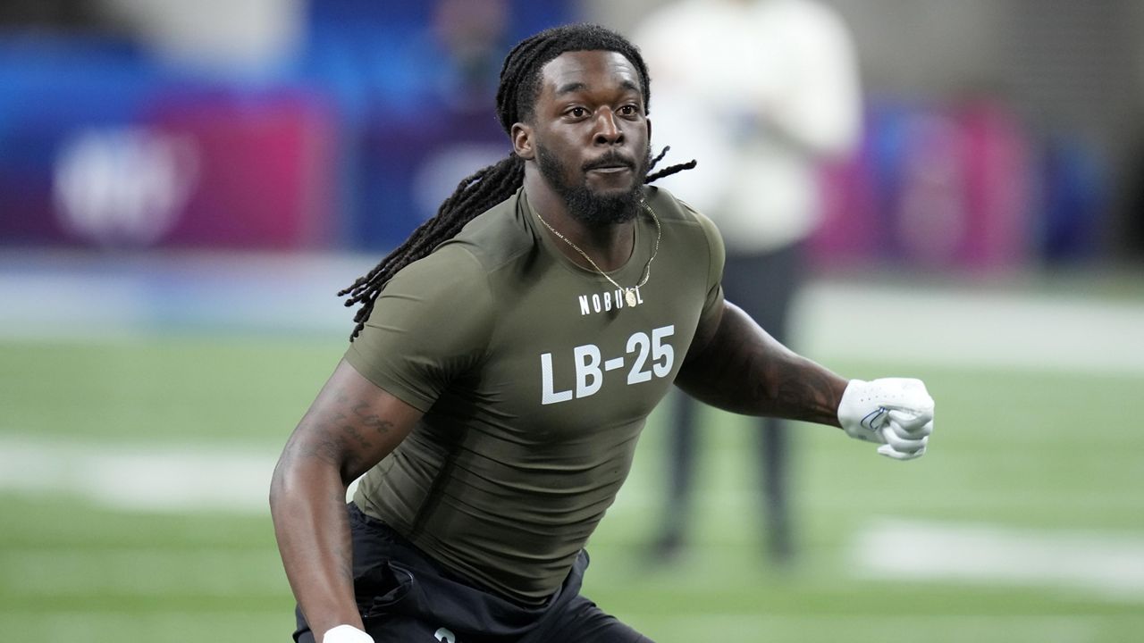 Kansas linebacker Lonnie Phelps runs a drill at the NFL football scouting combine in Indianapolis, March 2, 2023. The Cleveland Browns cut Phelps on Thursday, June 20, 2024 following his arrest on drunken driving charges after he crashed his SUV into a restaurant in Florida. (AP Photo/Michael Conroy,)