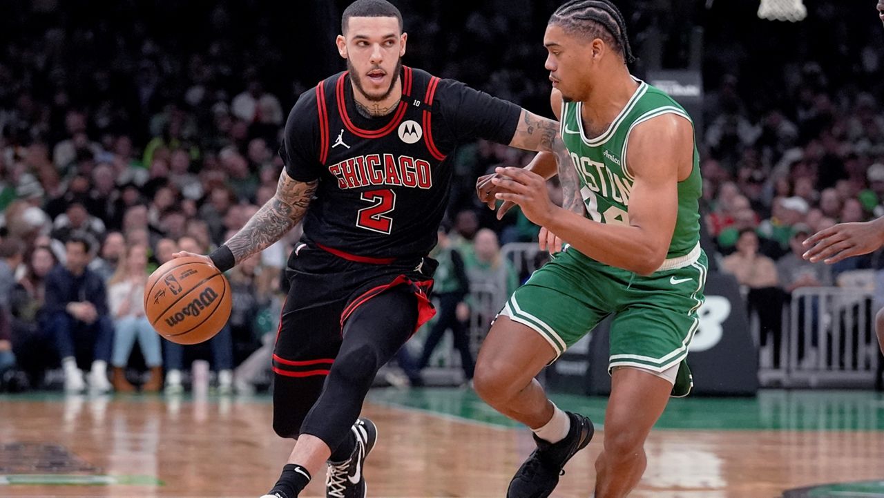 Chicago Bulls guard Lonzo Ball (2) drives to the basket against Chicago Bulls forward Patrick Williams during the first half of an NBA basketball game, Wednesday, Jan. 29, 2025, in Boston. (AP Photo/Charles Krupa)