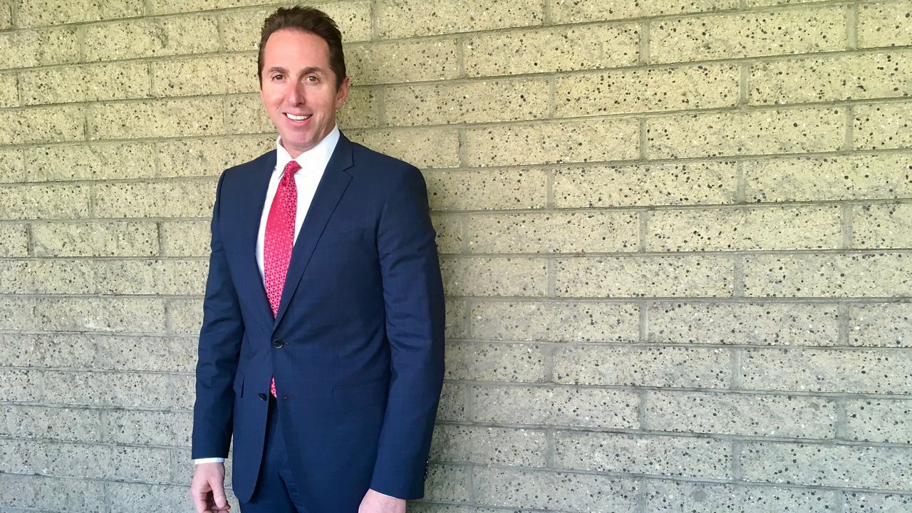 File photo of former Los Alamitos Mayor Troy Edgar at City Hall in Los Alamitos, Calif. (AP Photo/Amy Taxin)