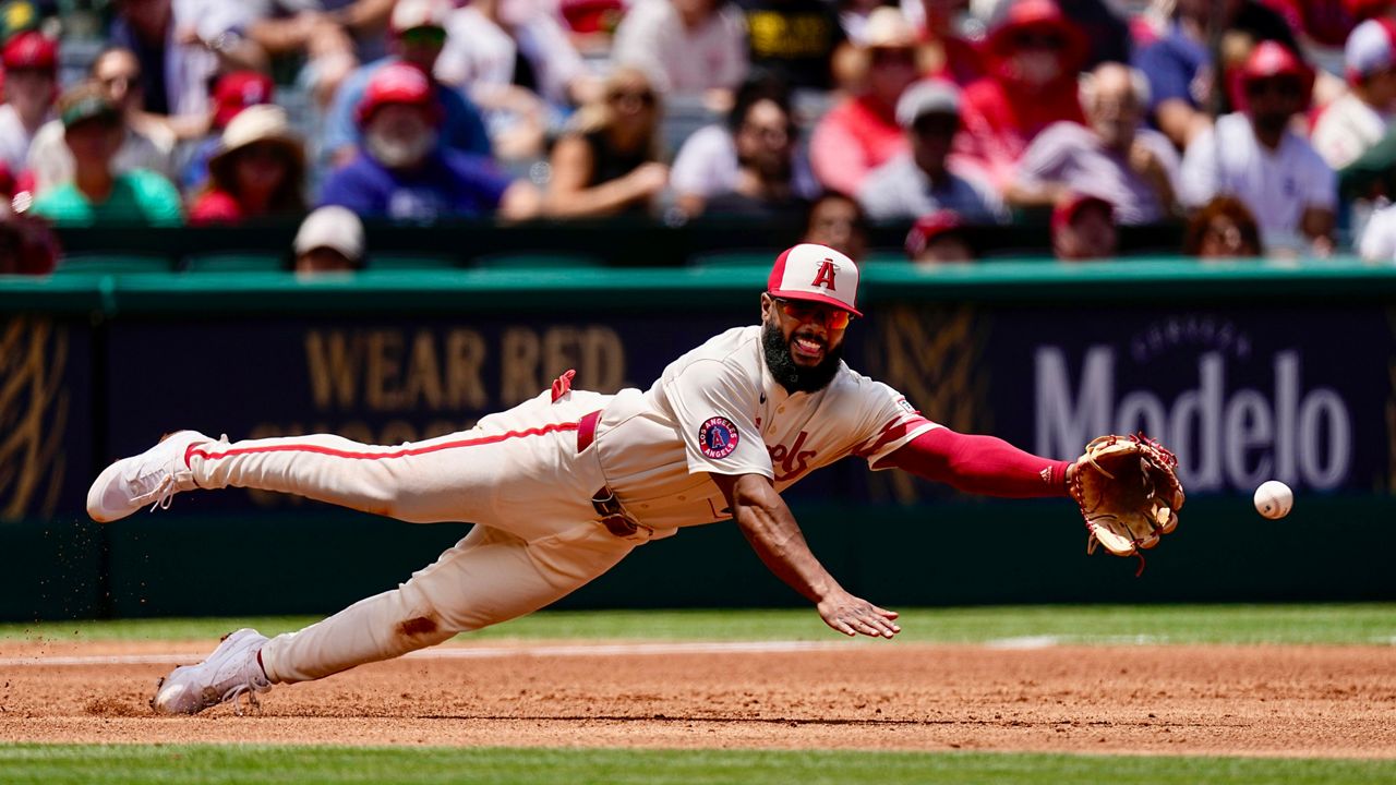 Los Angeles Angels third baseman Luis Rengifo can't reach a ball hit for an RBI single by Houston Astros' Jeremy Pena during the third inning of a baseball game Sunday, June 9, 2024, in Anaheim, Calif. (AP Photo/Mark J. Terrill)