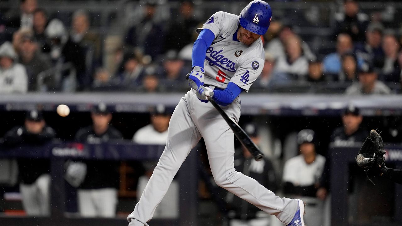 Los Angeles Dodgers' Freddie Freeman hits a two-run home run against the New York Yankees during the first inning in Game 3 of the baseball World Series, Monday, Oct. 28, 2024, in New York. (AP Photo/Frank Franklin II)