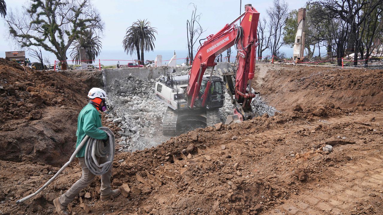 Construction begins on a property damaged by the Palisades Fire in the Pacific Palisades neighborhood of Los Angeles on April 24, 2025. (AP Photo/Damian Dovarganes)