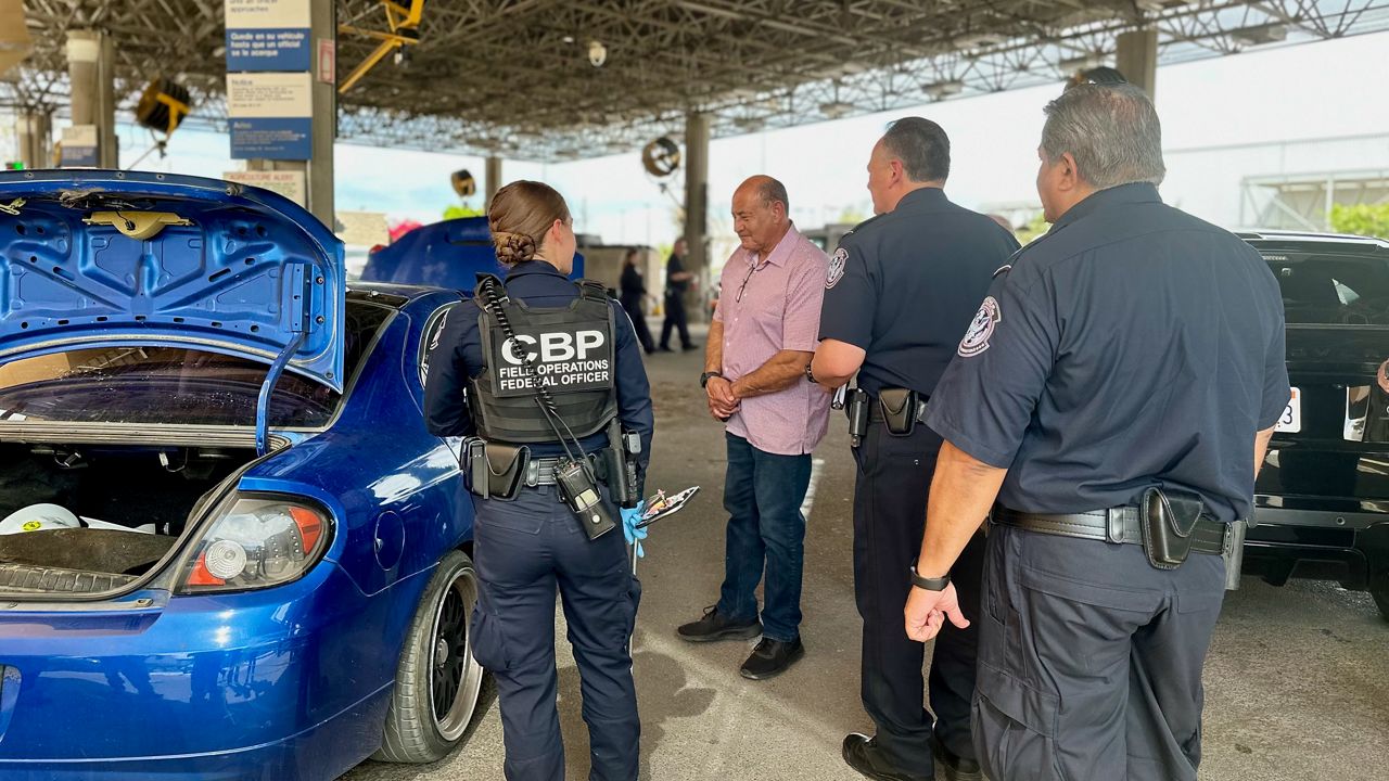 Rep. Lou Correa, D-Calif., Center, speaks with uniformed Customs and Border Patrol agents at a checkpoint along the Arizona-Mexico border. (Courtesy the office of Rep. Lou Correa)