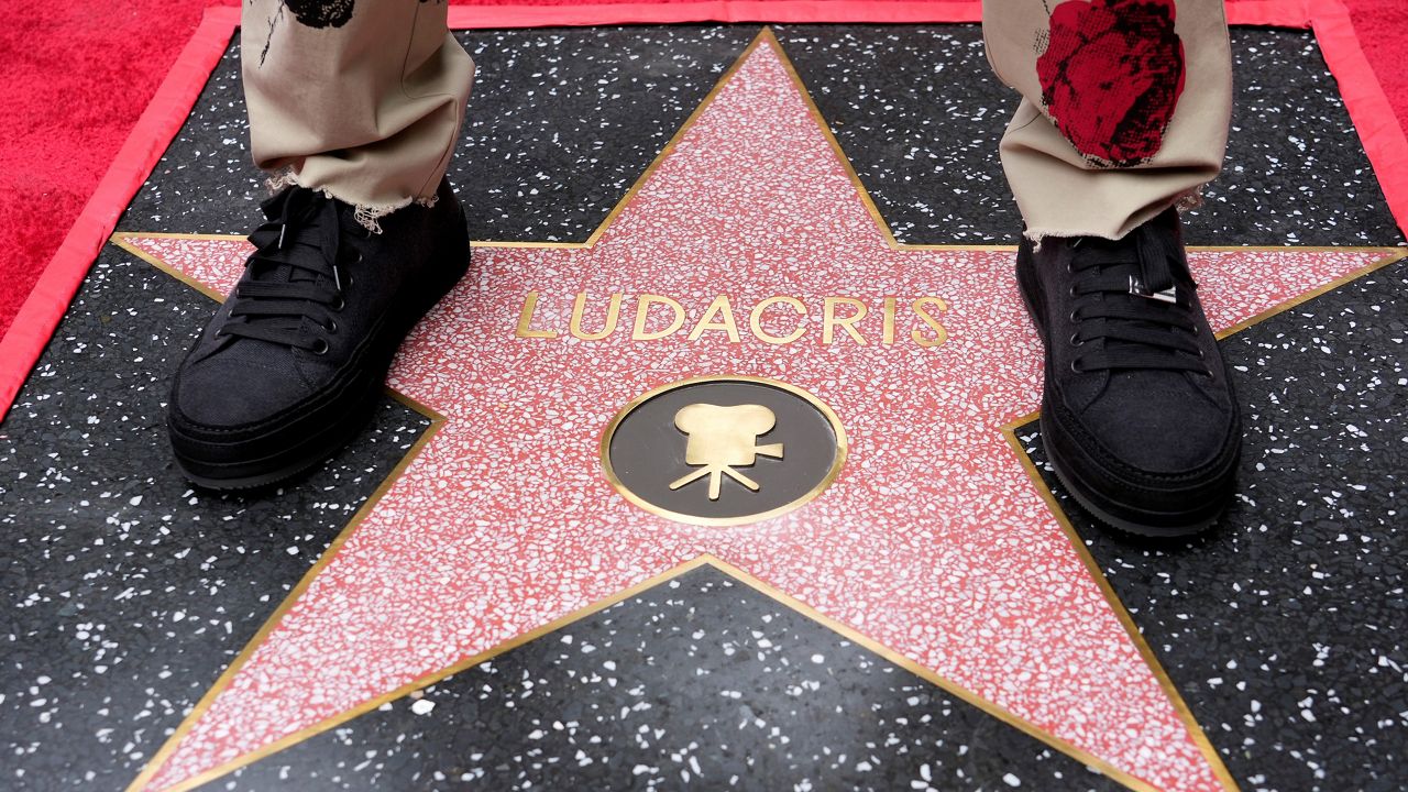 Ludacris stands on his star during a ceremony honoring him with a star on the Hollywood Walk of Fame Thursday, May 18, 2023, in Los Angeles. (AP Photo/Chris Pizzello)