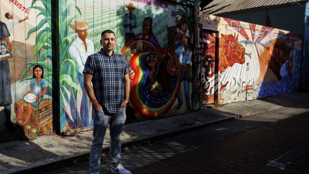 Luis A. Torres stands for a portrait at Balmy Alley in the Latino Cultural District on Friday, Sept. 20, 2024, in San Francisco. (AP Photo/Juliana Yamada)