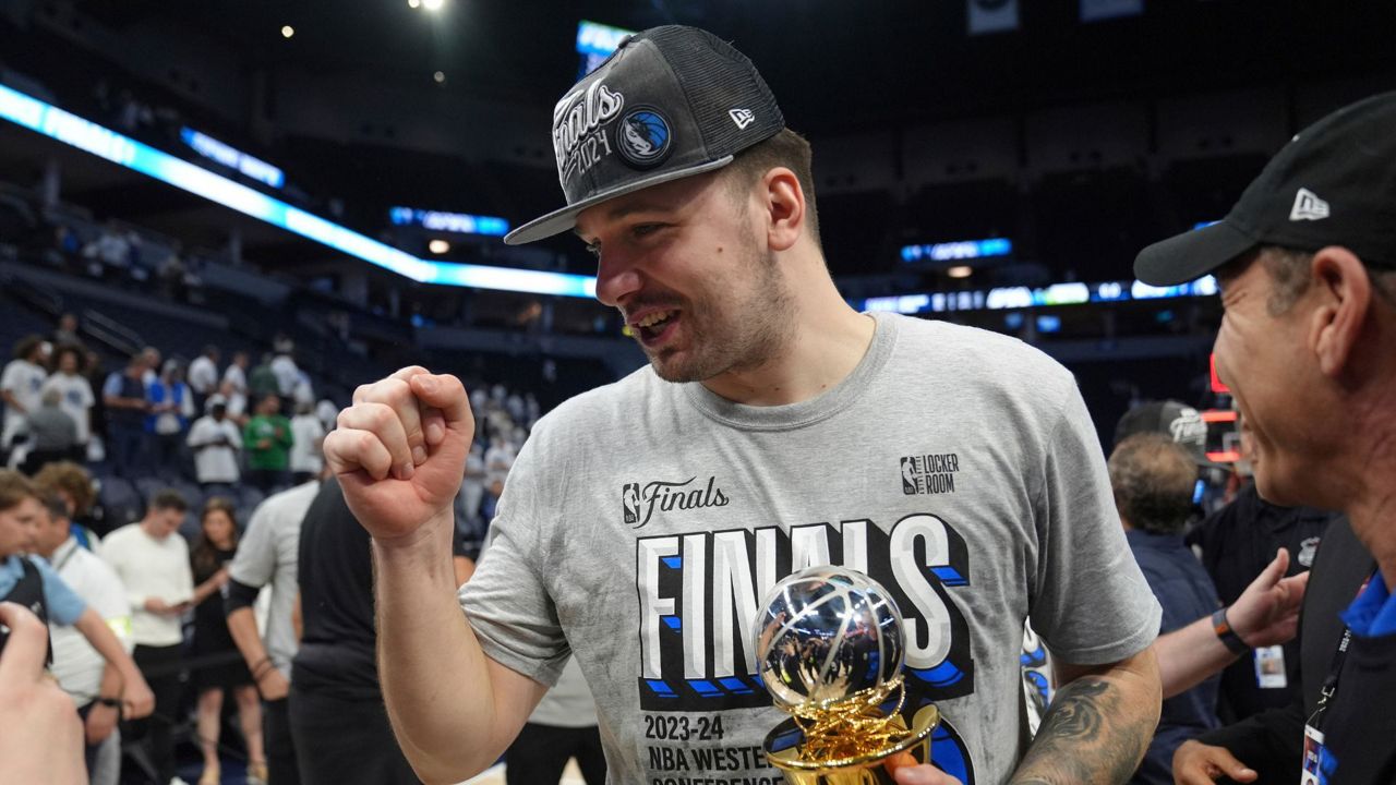 Dallas Mavericks guard Luka Doncic celebrates the team's win over the Minnesota Timberwolves in Game 5 of the Western Conference finals in the NBA basketball playoffs Thursday, May 30, 2024, in Minneapolis. (AP Photo/Abbie Parr)