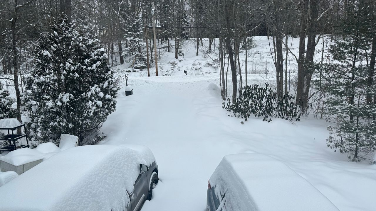 Snow tapers off as it stays cold