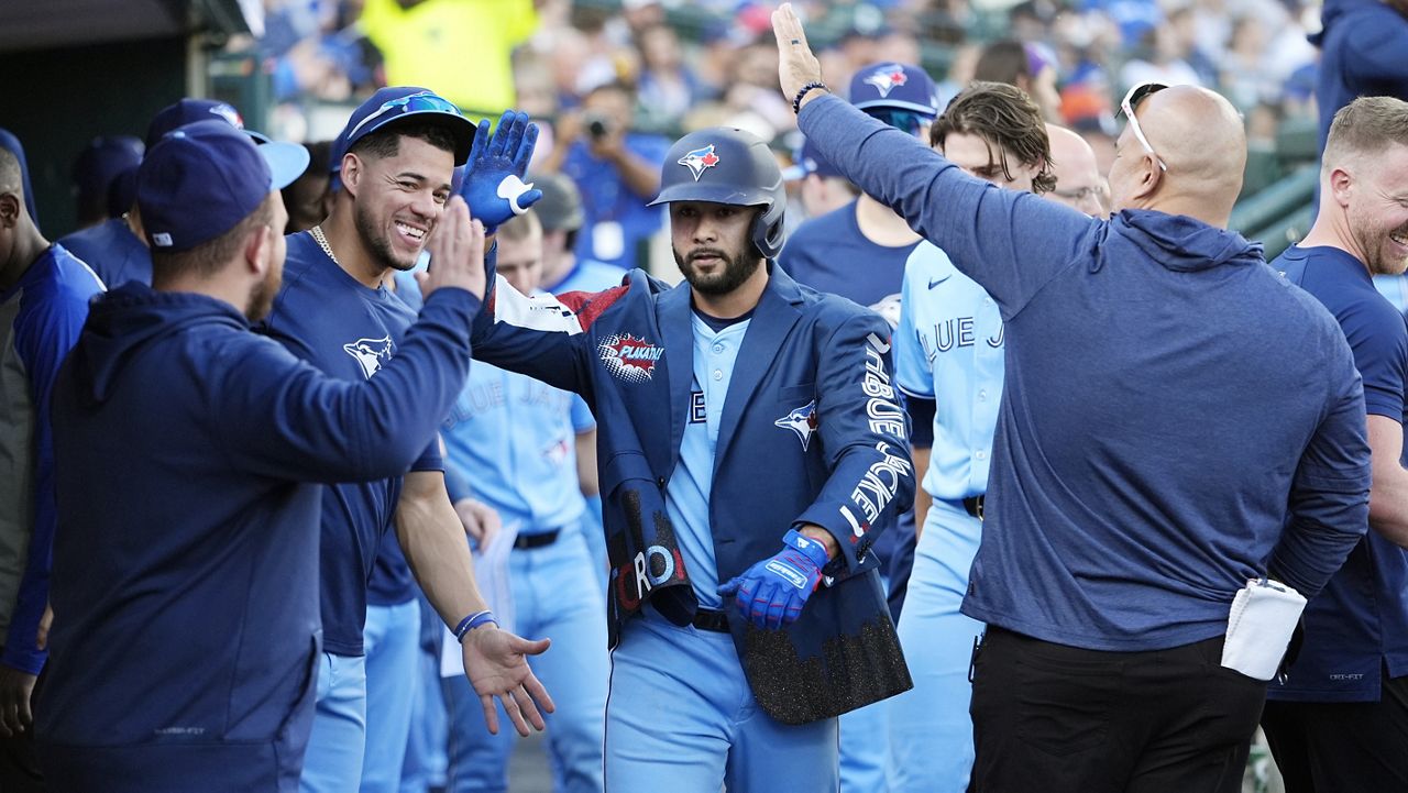 Mid-Pacific Institute alumnus Isiah Kiner-Falefa was congratulated by Toronto teammates after hitting a home run against the Detroit Tigers on May 23.