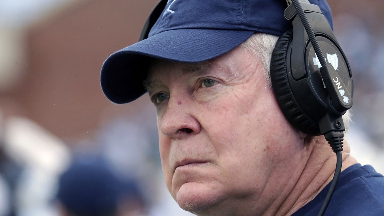 FILE - North Carolina coach Mack Brown watches as the team prepares for an NCAA college football game against Virginia Tech in Chapel Hill, N.C., Oct. 1, 2022. Brown is calling out the NCAA for dragging its heels on the case of transfer wide receiver Devontez Walker, who has not yet been ruled eligible. (AP Photo/Chris Seward, File)