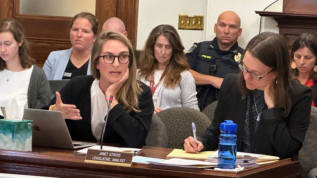 Rep. Maggie O'Neil (D-Saco), left, talks to the Judiciary Committee Monday about one of her electronic privacy bills. (Spectrum News/Susan Cover)