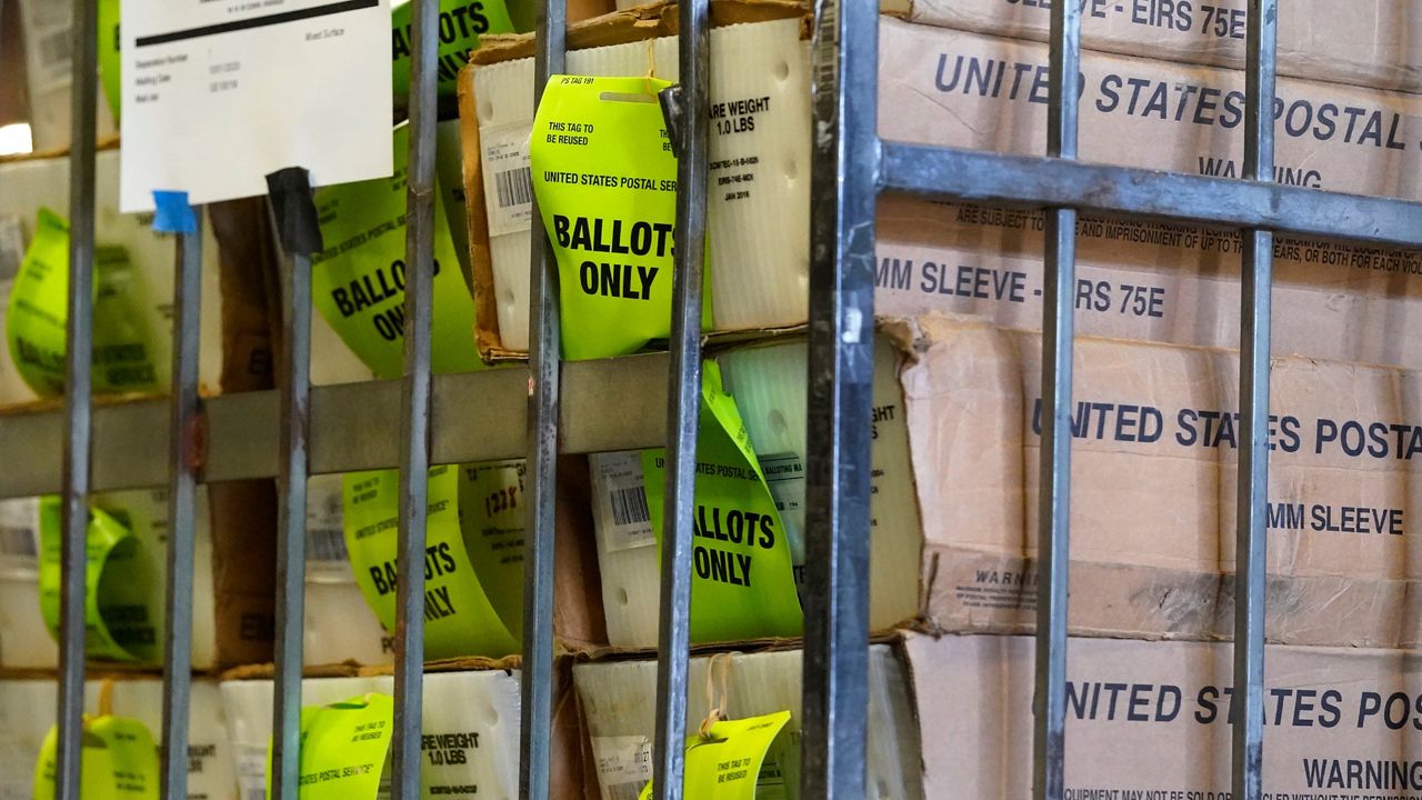 A cart of vote-by-mail ballots is seen before being loaded into a truck for transport to a U.S. Postal Service office in Florida, Thursday, Oct. 1, 2020 (Wilfredo Lee/AP)