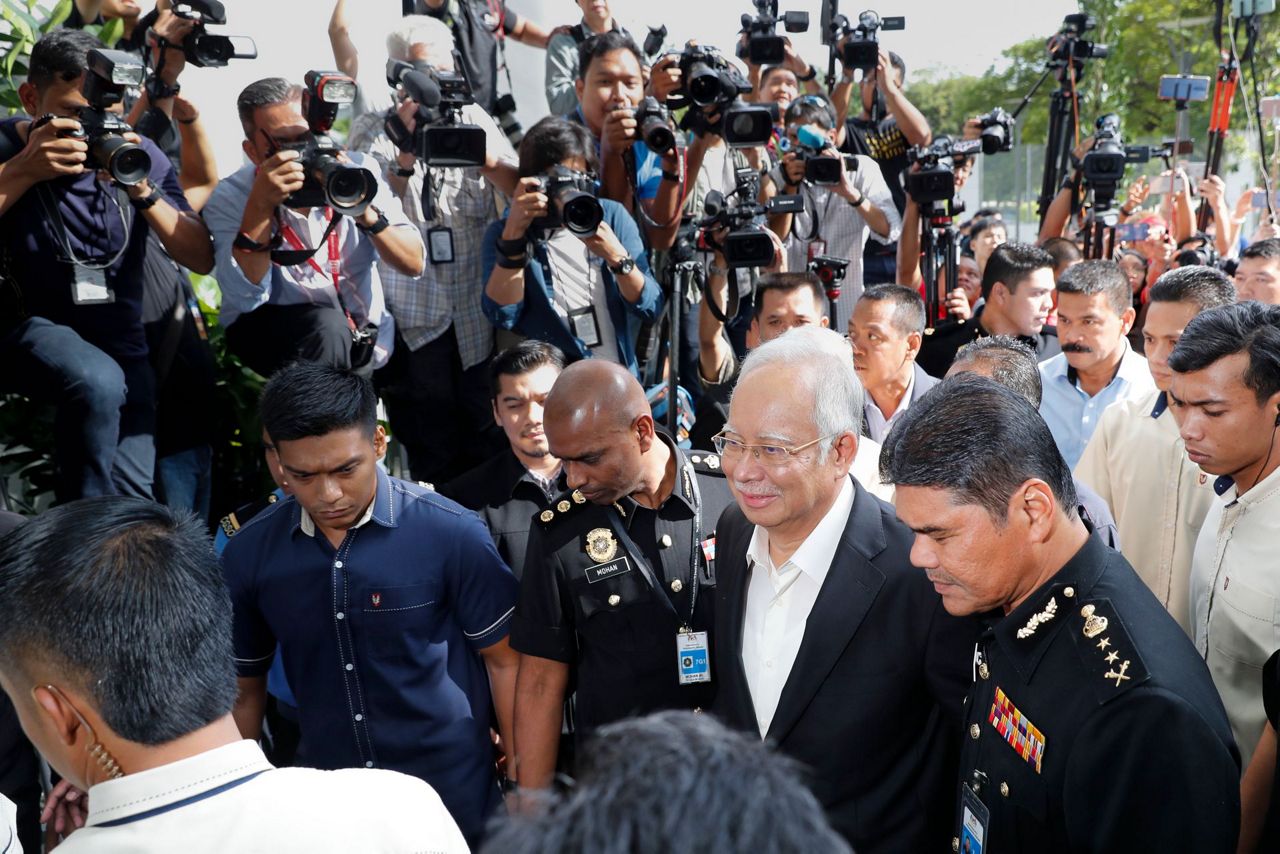 Malaysia's ex-leader questioned again in corruption scandal