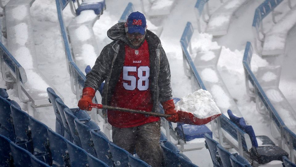 A worker helps remove snow from Highmark Stadium in Orchard Park, N.Y., Sunday Jan. 14, 2024. A potentially dangerous snowstorm that hit the Buffalo region on Saturday led the NFL to push back the Bills wild-card playoff game against the Pittsburgh Steelers from Sunday to Monday. New York Gov. Kathy Hochul and the NFL cited public safety concerns for the postponement, with up to 2 feet of snow projected to fall on the region over a 24- plus hour period. (AP Photo/ Jeffrey T. Barnes)