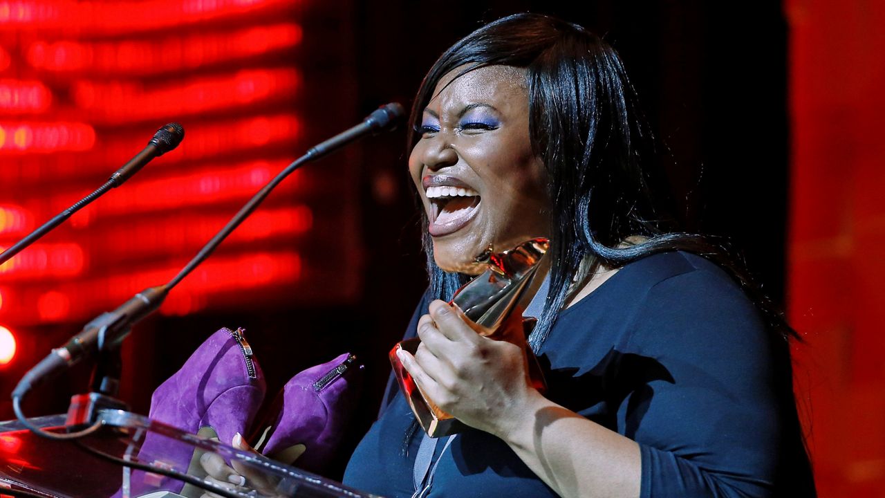 Mandisa accepts the award for pop/contemporary album of the year at the Dove Awards on Oct. 7, 2014, in Nashville, Tenn. (AP Photo/Mark Humphrey)