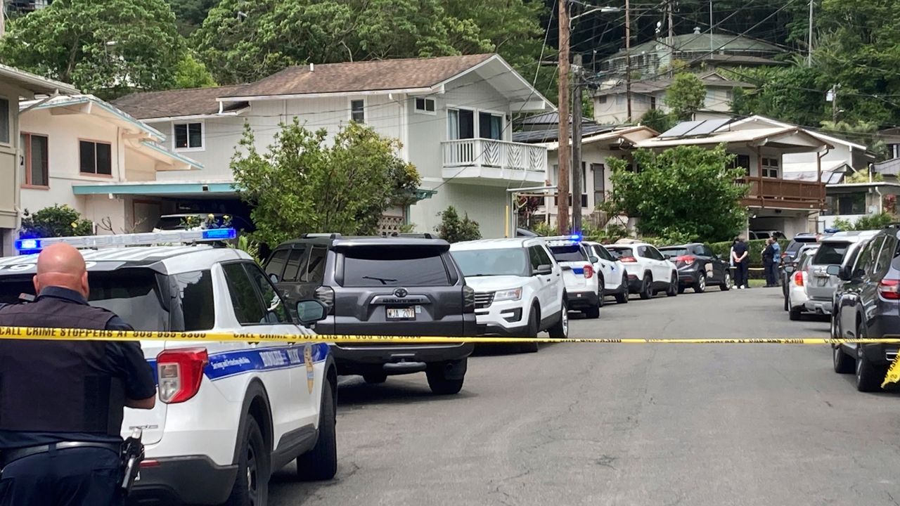 Honolulu police investigate the killings of the Oda family at a home in Manoa on Sunday. (Craig T. Kojima/Honolulu Star-Advertiser via AP)