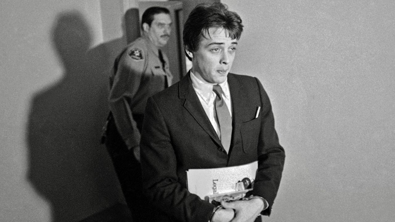 FILE - In this Jan. 21, 1970 file photo, Robert K.Beausoleil, then 21, leaves a courtroom in Los Angeles. Calif. Officials Thursday, Oct. 14, 2016 denied parole again for the 68-year-old Beausoleil, a follower of cult leader Charles Manson, who is serving a life term for the 1969 slaying of musician Gary Hinman. (AP Photo/George Brich, File)       