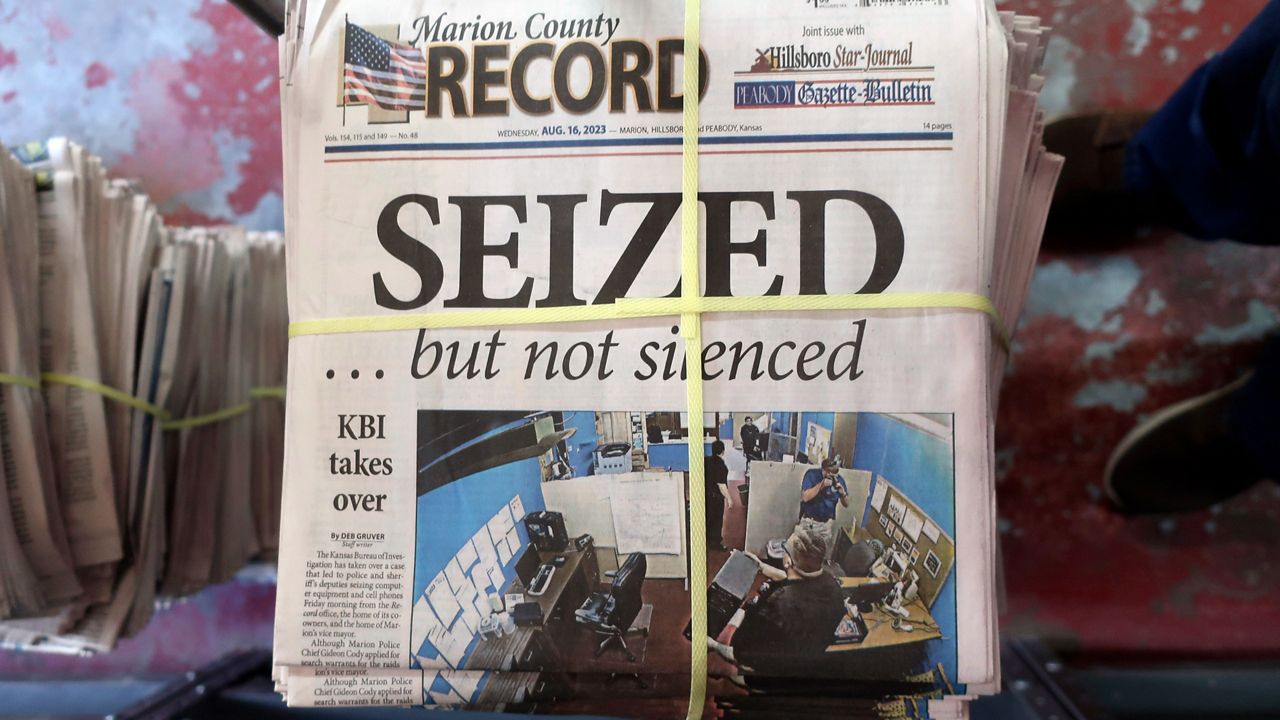 A stack of the latest weekly edition of the Marion County Record sits in the back of the newspaper's building, awaiting unbundling, sorting and distribution, Wednesday, Aug. 16, 2023, in Marion, Kan. The newspaper's front page was dedicated to two stories about a raid by local police on its offices and the publisher's home on Aug. 11, 2023. (AP Photo/John Hanna)