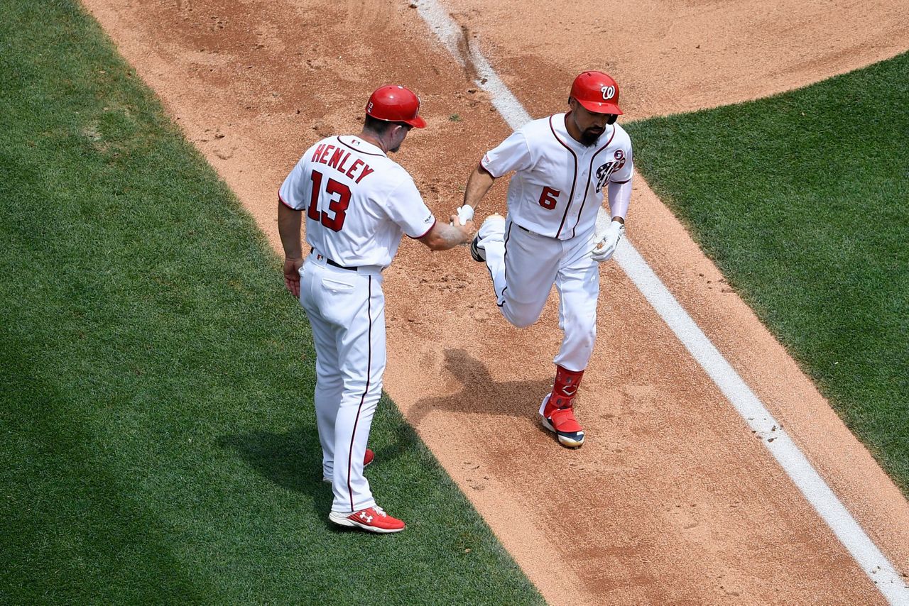 Washington Nationals' Trea Turner wears patriotic batting gloves