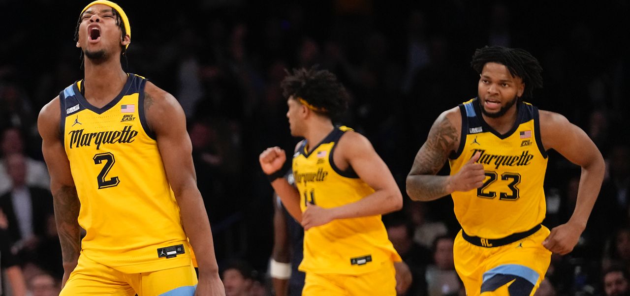 Marquette guard Chase Ross (2) reacts after scoring a 3-point basket against Villanova in overtime of an NCAA college basketball game in the quarterfinals of the Big East Conference tournament, Friday, March 15, 2024, in New York. (AP Photo/Mary Altaffer)