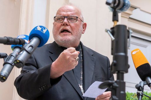Cardinal Reinhard Marx, Archbishop of Munich and Freising, gives a statement to the press in the courtyard of his residence in Munich, Friday, June 4, 2021.  (Peter Kneffel/dpa via AP, File)