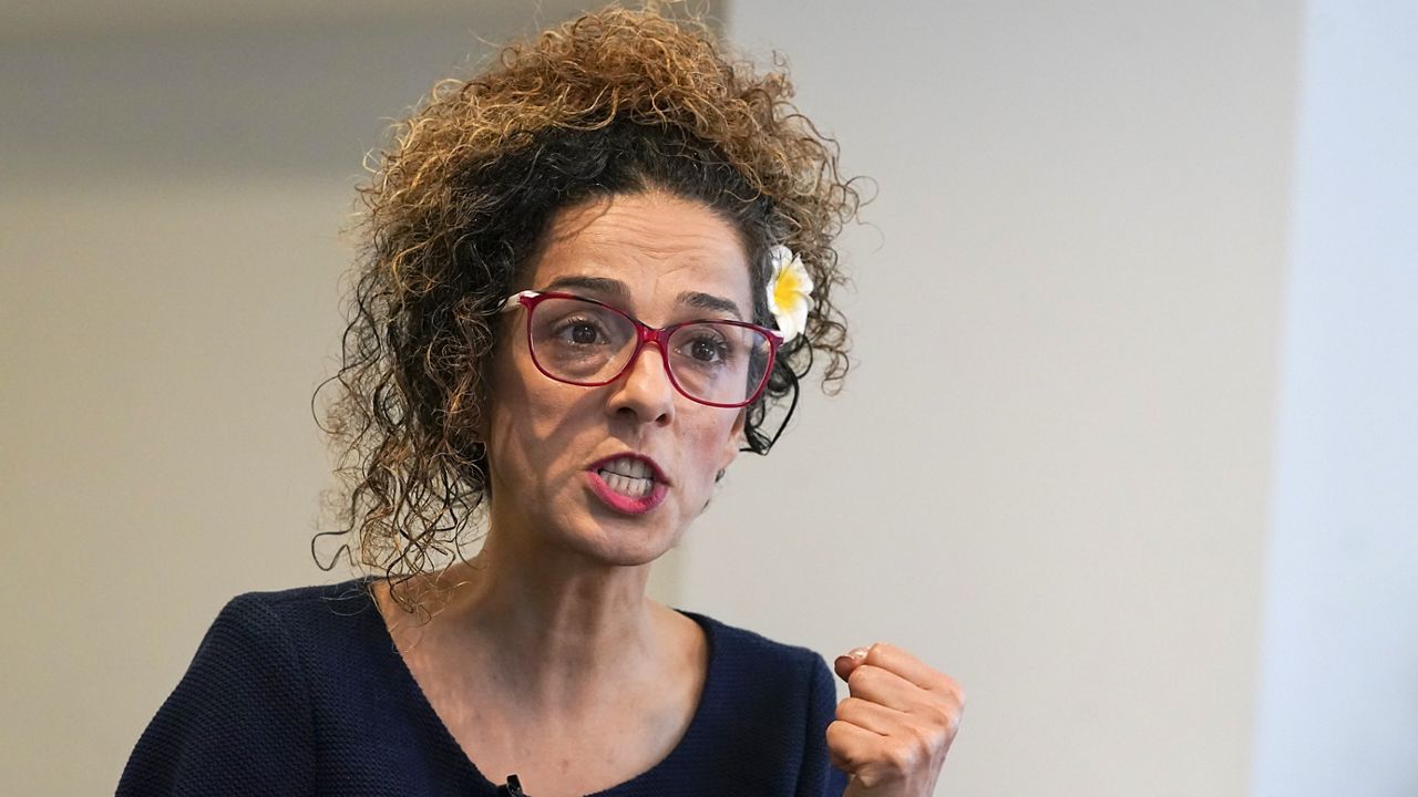 Iranian dissident Masih Alinejad gestures as she speaks during an interview with The Associated Press, Friday, Sept. 23, 2022, in New York. (AP Photo/Mary Altaffer, File)