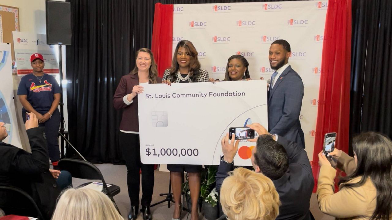 (left to right) Mastercard Vice-President Deann Donohue mark's the company's donation of $1 million to the city of St. Louis' Economic Justice Accelerator Fund during a news conference Tuesday with St. Louis Mayor Tishaura Jones, U.S. Rep. Cori Bush D-St. Louis and Neal Richardson, President and CEO of the St. Louis Development Corporation. (Spectrum News/Gregg Palermo)