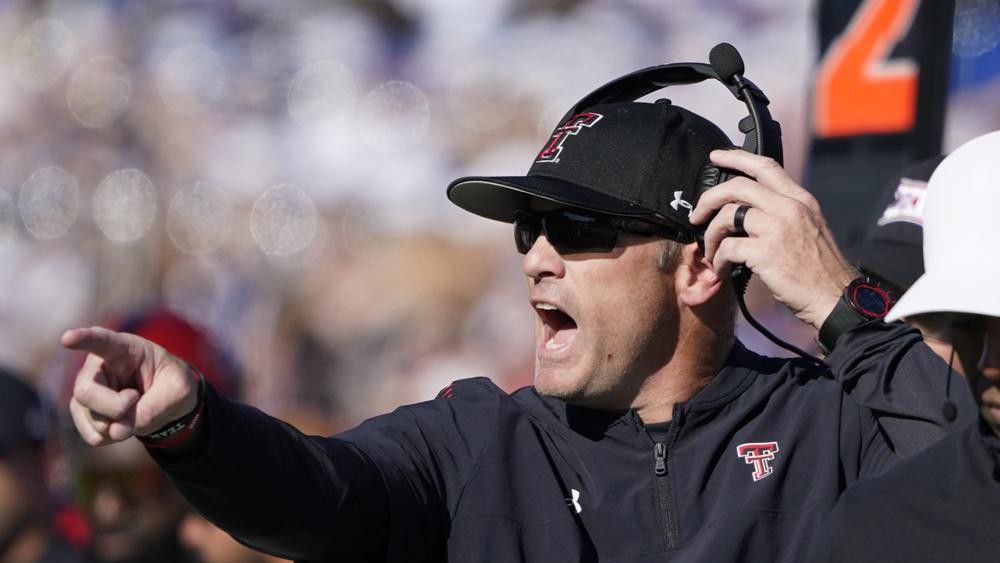 Texas Tech head coach Matt Wells yells instructions to his team against the Kansas during the second quarter of an NCAA college football game Saturday, Oct. 16, 2021, in Lawrence, Kan. (AP Photo/Ed Zurga)
