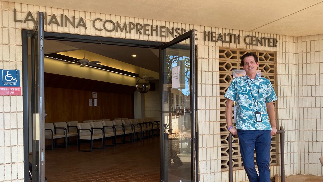 Maui's Public Health Program Manager John Oliver stands in front of the Lahaina Comprehensive Health Center. (Michelle Broder Van Dyke/Spectrum News)