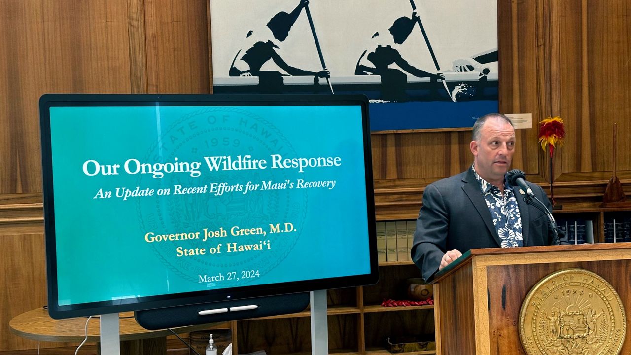 Hawaii Gov. Josh Green addresses a news conference in Honolulu on Wednesday, March 27, 2024. Green said some 3,000 people displaced by Lahaina's wildfires are still living in hotels more than seven months after the Aug. 8 blaze but that up to 30 people are moving to longer-term housing each day. (AP Photo/Audrey McAvoy)