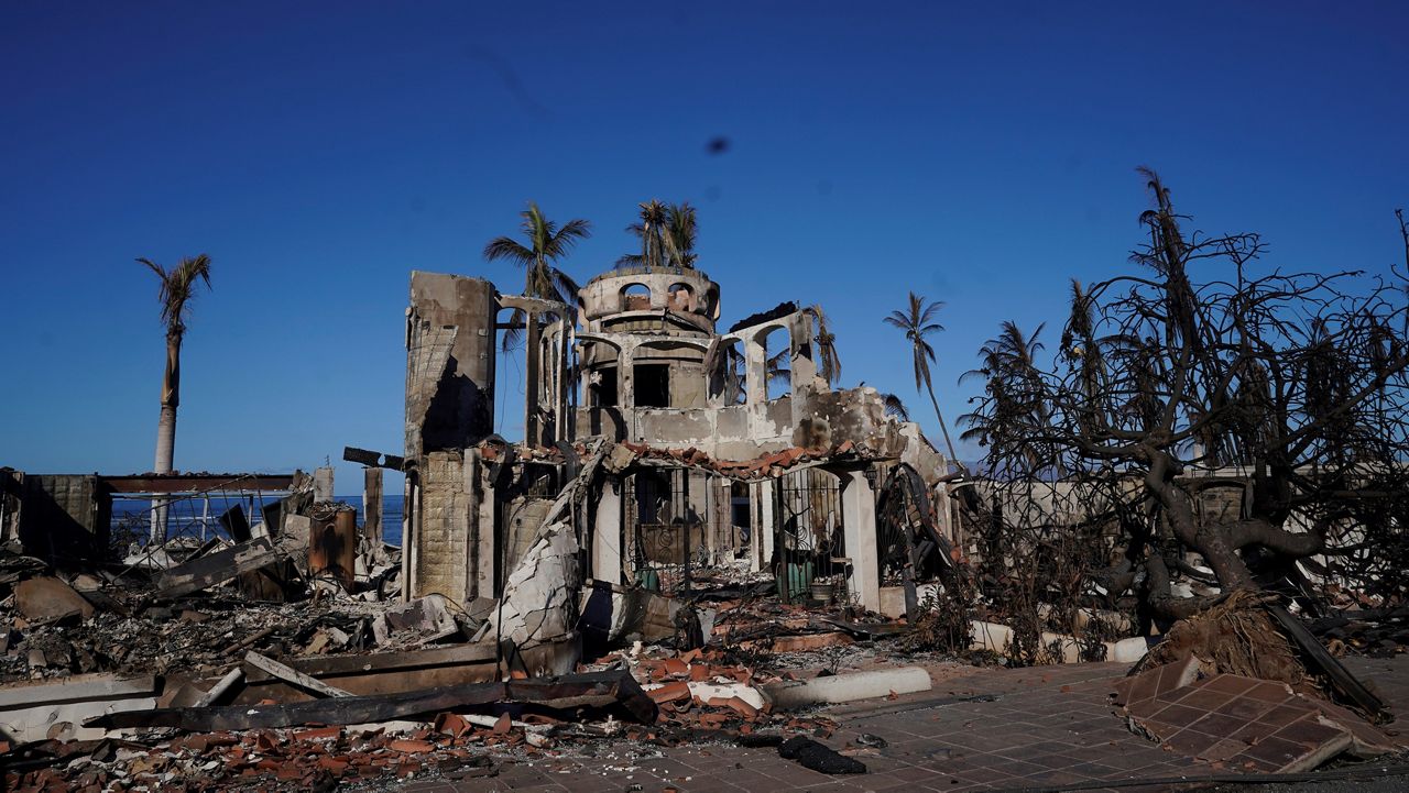 Wildfire damage is shown, Saturday, Aug. 12, 2023, in Lahaina, Hawaii. (AP Photo/Rick Bowmer)