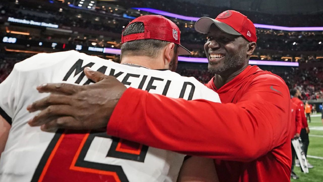 Buccaneers head coach Todd Bowles celebrates with quarterback Baker Mayfield after the Bucs beat Atlanta 29-25 on Dec. 10 in Atlanta. (AP Photo/Brynn Anderson)