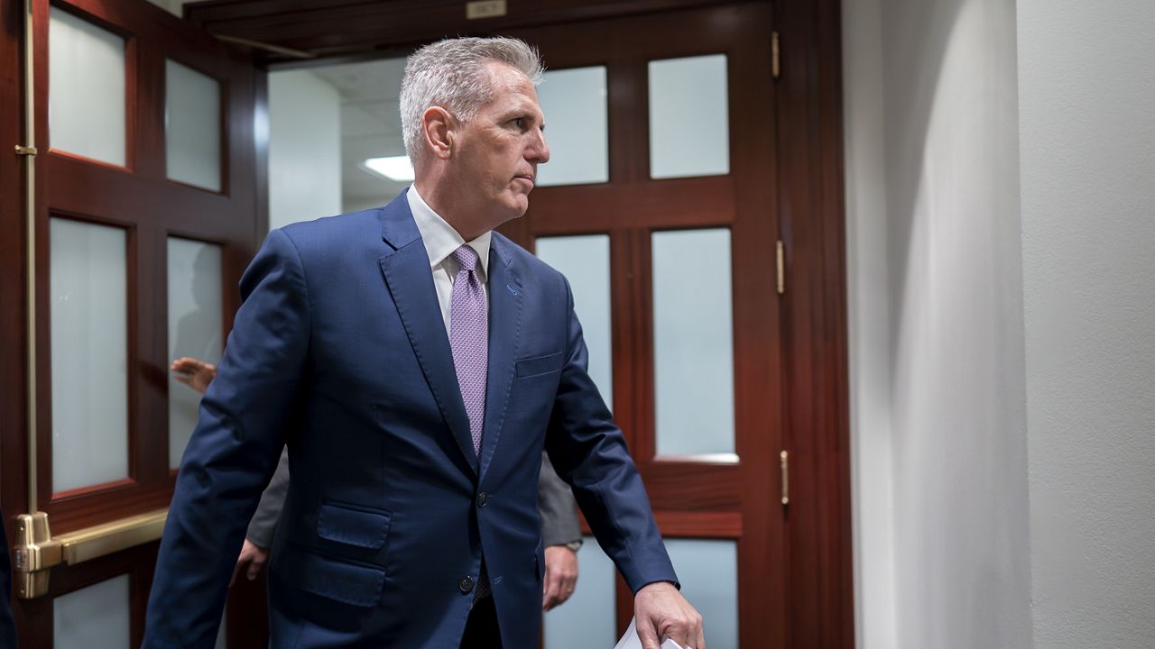 Speaker of the House Kevin McCarthy, R-Calif., emerges from a closed-door meeting with fellow Republicans as he tries to round up the votes for his debt ceiling package, at the Capitol in Washington, Wednesday, April 26, 2023. (AP Photo/J. Scott Applewhite)