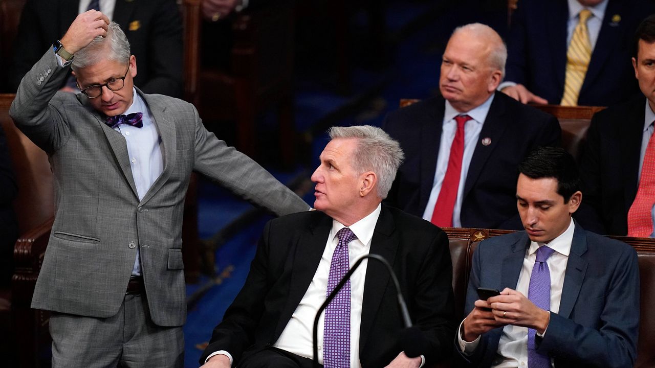 Rep. Patrick McHenry, R-N.C., left, talks with Rep. Kevin McCarthy, R-Calif., as they listen to the fifth round of votes in the House chamber as the House meets for a second day to elect a speaker and convene the 118th Congress in Washington, Wednesday, Jan. 4, 2023. (AP Photo/Alex Brandon)