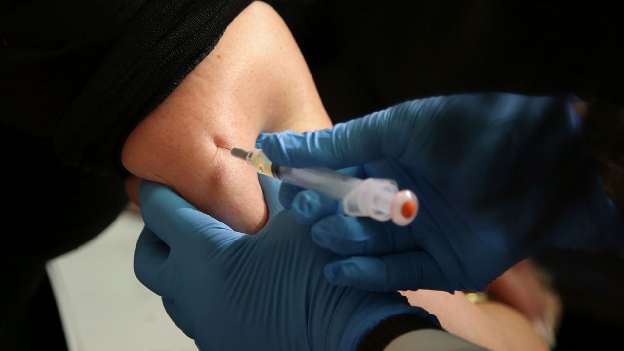 In this March 27, 2019, file photo, a woman receives a measles, mumps and rubella vaccine at the Rockland County Health Department in Pomona, N.Y. Measles outbreaks in the U.S. and abroad are raising health experts' concern about the preventable, once-common childhood virus. The CDC on Thursday, April 11, 2024 released a report on recent measles case trends, noting that cases in the first three months of this year were 17 times higher than the average number seen in the first three months of the previous three years. (AP Photo/Seth Wenig, File)