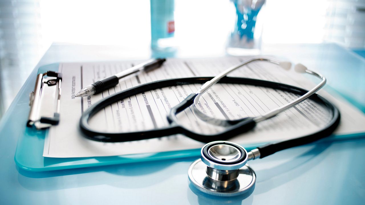 A stethoscope and medical paperwork. (Getty Images)