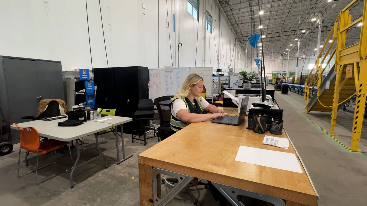 Small business owner utilizing Amazon delivery partnership