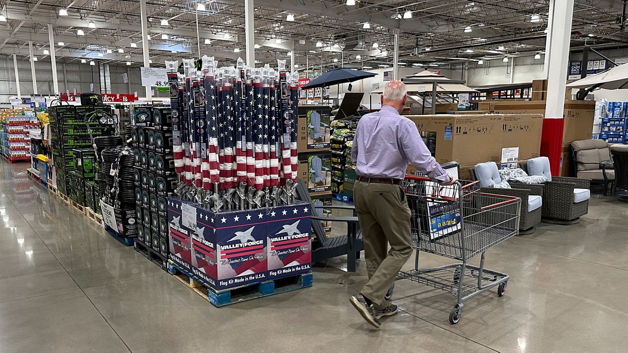 A shopper moves past a display of items in a Costco warehouse Saturday, May 18, 2024, in Sheridan, Colo. (AP Photo/David Zalubowski)