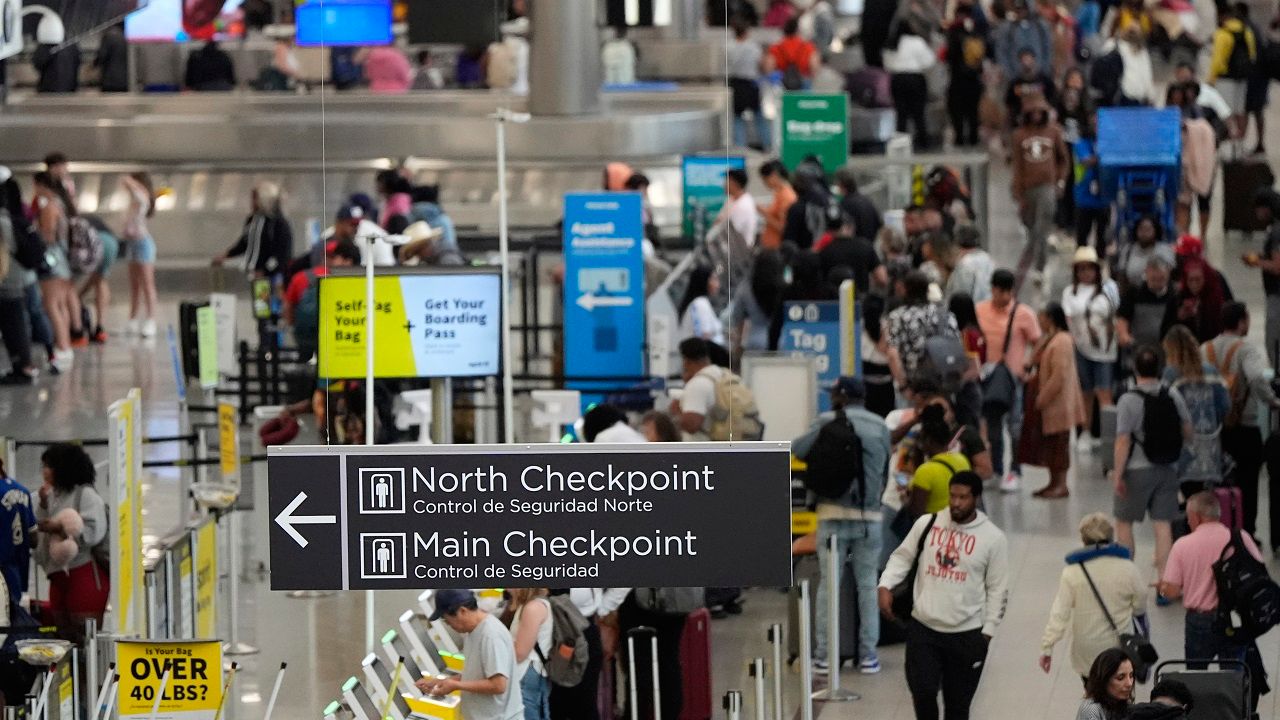 Travelers move through Hartsfield-Jackson Atlanta International Airport ahead of Memorial Day, Friday, May 24, 2024, in Atlanta.(AP Photo/Mike Stewart)