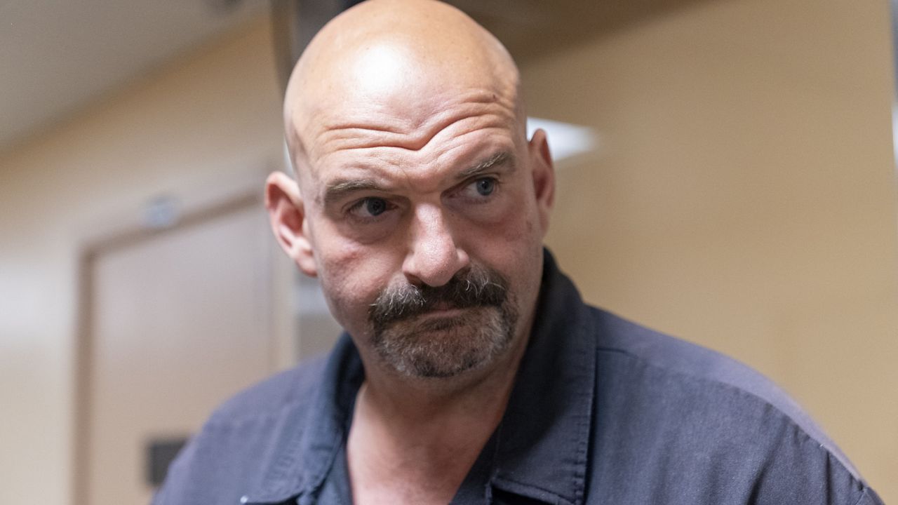 FILE - Sen. John Fetterman, D-Pa., walks to a vote on Capitol Hill, Wednesday, Sept. 6, 2023, in Washington. In a statement on Saturday, Sept. 23, Fetterman became the first Senate Democrat to call for Sen. Robert Menendez to step down after Menendez and his wife were indicted on sweeping corruption charges. (AP Photo/Alex Brandon, File)