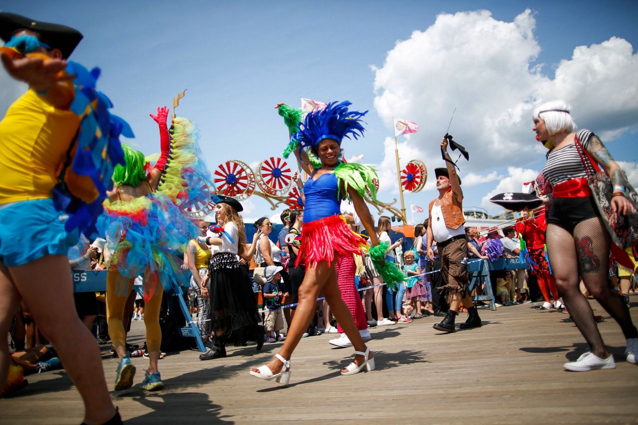 Woody Guthrie's children named Mermaid Parade king and queen